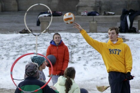 University of Pittsburgh student Andrew Bulman, right, of Bryn Mawr, Pa., leaps to make a pass during a Quidditch match in Pittsburgh 2012.