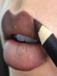 MAC put up an unretouched photo of a model with lip hair, and people are very impressed