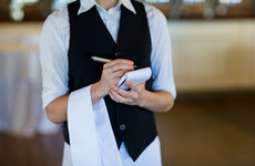 A waitress who was sacked over a bad TripAdvisor review has been awarded €2,000