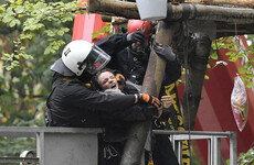German police pelted with stones and Molotov cocktails in standoff with environmentalists