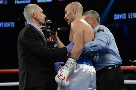 Gary O'Sullivan is stopped by referee Russel Mora during his middleweight boxing match against David Lemieux.