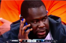 VIDEO: Nets fan gets hit by ball while texting