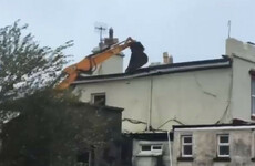 JCB prevents roof blowing off building in Galway