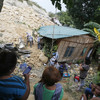Rescuers frantically dig for survivors as death toll rises after landslide in the Philippines