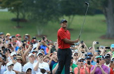 Composed Tiger Woods on course to secure first title since 2013