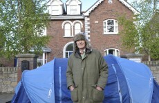 Evicted couple set up tent outside former home