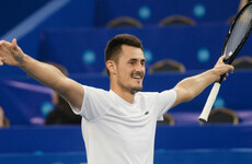 Tomic saves four match points to end three-year title drought