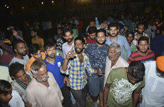 At least 50 dead after train strikes crowd in India