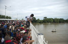 Tense standoff as migrants on way to US met with wall of police at Mexican border