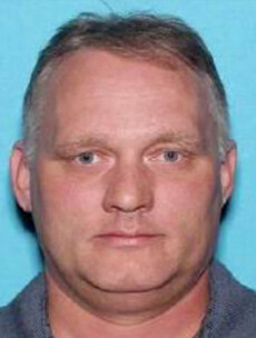 Synagogue shooting suspect appears in court in a wheelchair