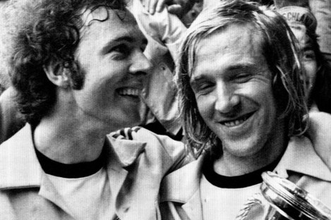 Franz Beckenbauer, left, and Gunter Netzer bask in the sweaty glory of triumph.