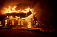 Fast-moving wildfires kill at least five people and force 157,000 to evacuate their homes in US