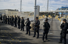 Tensions rise at US-Mexico border as migrants protest amid army show of force