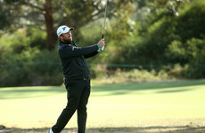 Lowry and Dunne slip back after struggling in wet and windy conditions at World Cup of Golf