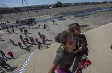 Migrants retreat as US border agents push them back with tear gas and rubber bullets