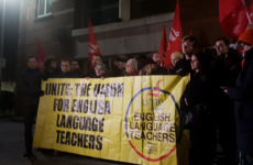 Supporters of English language teachers protest at school after sudden closure