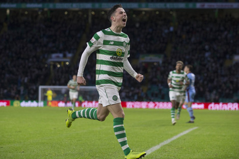 Mikey Johnston celebrates after opening the scoring for Celtic in today's win over Dundee.