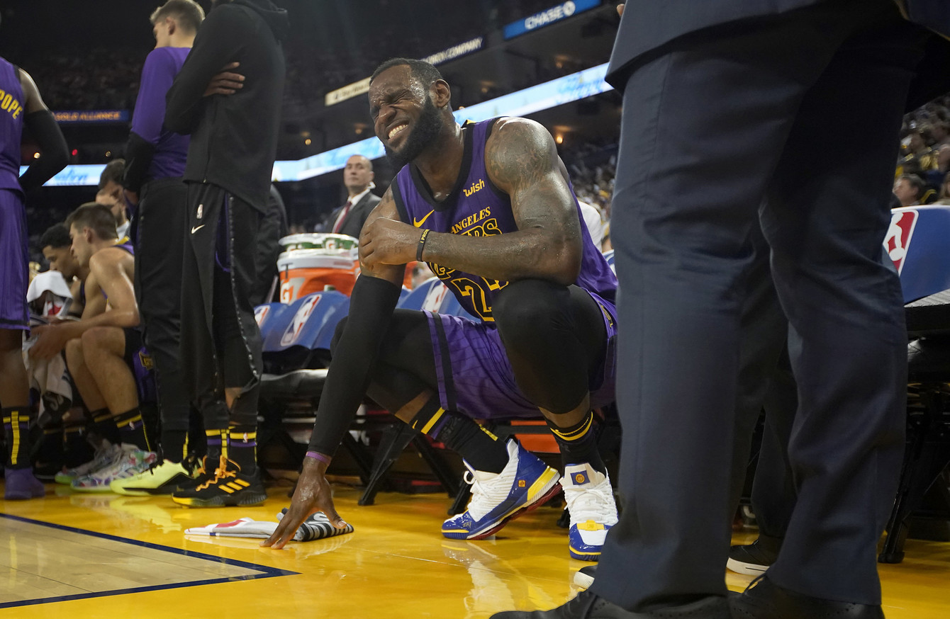 LeBron James injured in Lakers Christmas Day rout of defending champion