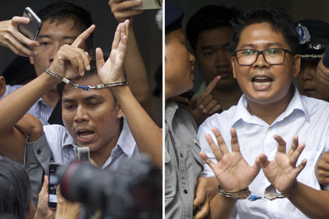 euters journalists Kyaw Soe Oo, left, and Wa Lone, are handcuffed as they are escorted by police out of the court last September. 