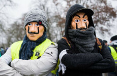 'Macron out': Tens of thousands of 'yellow vest' protesters march in France