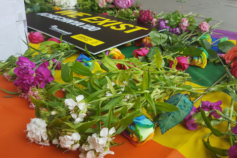 Flowers laid on a flag outside the Russian embassy in London during a protest against a purge of gay men in Chechnya in 2017