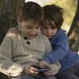 Children who own mobile phones at younger age perform worse in reading and maths tests