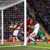 Salah scores landmark goal as Liverpool survive scare to extend lead at top