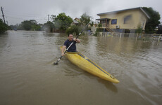 Once-in-a-century floods turn streets to rivers in northeastern Australia