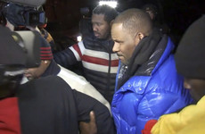 R Kelly hands himself into police following 10 sex abuse charges