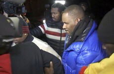 R Kelly hands himself into police following 10 sex abuse charges
