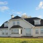 Applause in auction room as woman buys back brother's repossessed home
