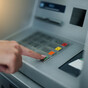 Two people arrested after digger used to steal ATM in Co Antrim