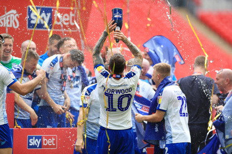 Tranmere players celebrate their dramatic play-off victory at Wembley.