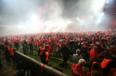 Brilliant scenes as fans invade pitch after Berlin club claim promotion to Bundesliga for the first time