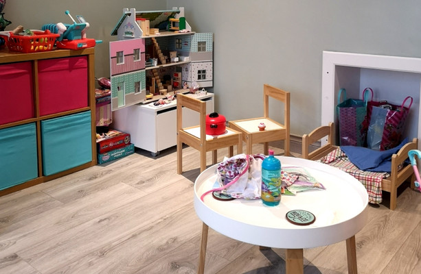 We set up a play area under the stairs Inside this toddler