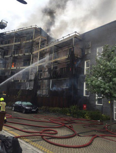100 firefighters tackle massive blaze at block of flats in east London