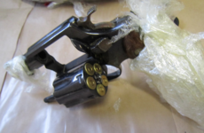 Two handguns wrapped in cling film found during gangland searches
