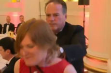 UK minister suspended after grabbing female climate protester by the neck