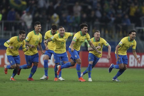 Brazil celebrate winning at the end of the shootout.