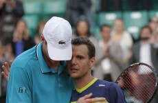 Marathon man Isner beaten in fourth longest in Grand Slam history