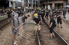 Thousands of Hong Kong protesters march despite police ban