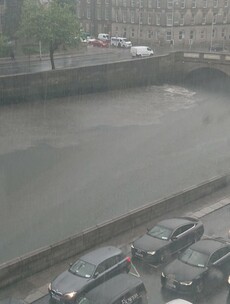 Sewer debris discharges into River Liffey after heavy downpours yesterday