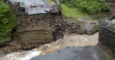 Bridge collapses in England as areas are hit by severe flooding