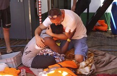 Migrants jump off rescue boat in bid to reach Italian island