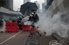 Police fire tear gas and water cannon as Hong Kong protesters defy rally ban