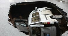 In pictures: Van trapped after road suddenly caves in