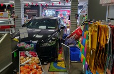 Man in his 40s arrested after car crashes through Dublin shop