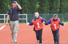Magic moment: young athletes run race together after starting gun fright