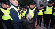 Extinction Rebellion protesters moved by gardaí during sit-in outside Dáil