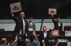 'Carrie Lam step down!': Chaotic scenes in Hong Kong legislature as hecklers shout down major speech